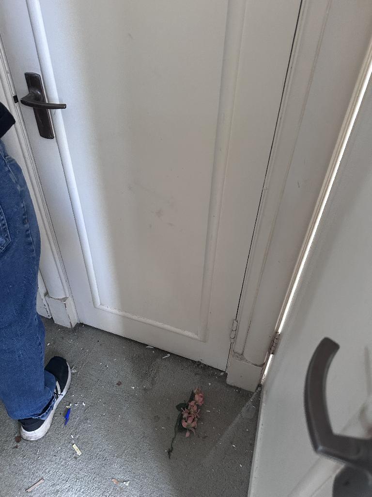 Household clutter clearance in Chelsea after service, showing a cleared doorway corner floor
