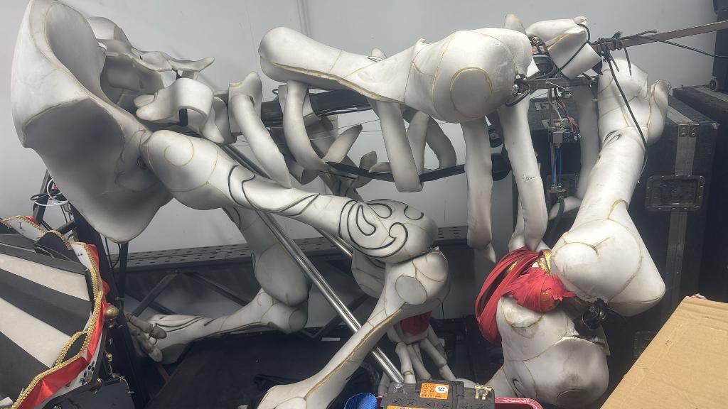 Rubbish removal before in Dollis Hill showing large decorative figures stored in a cluttered area
