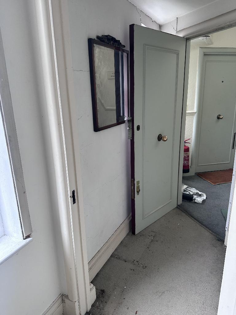 Flat clearance in Chelsea after clearance, showing a cleared doorway area