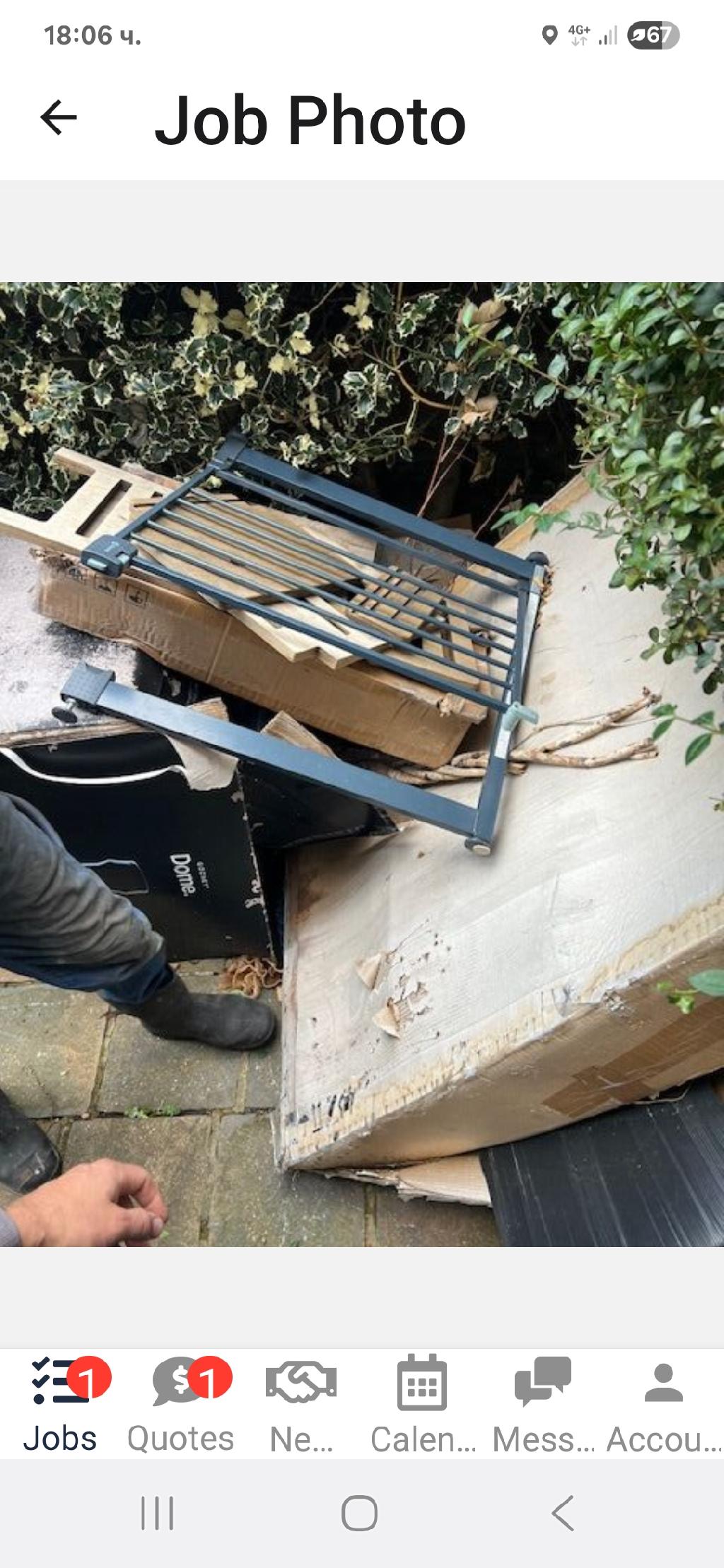 Rubbish removal before on Hoe Street, showing a bulky metal frame lying on the pavement near garden greenery
