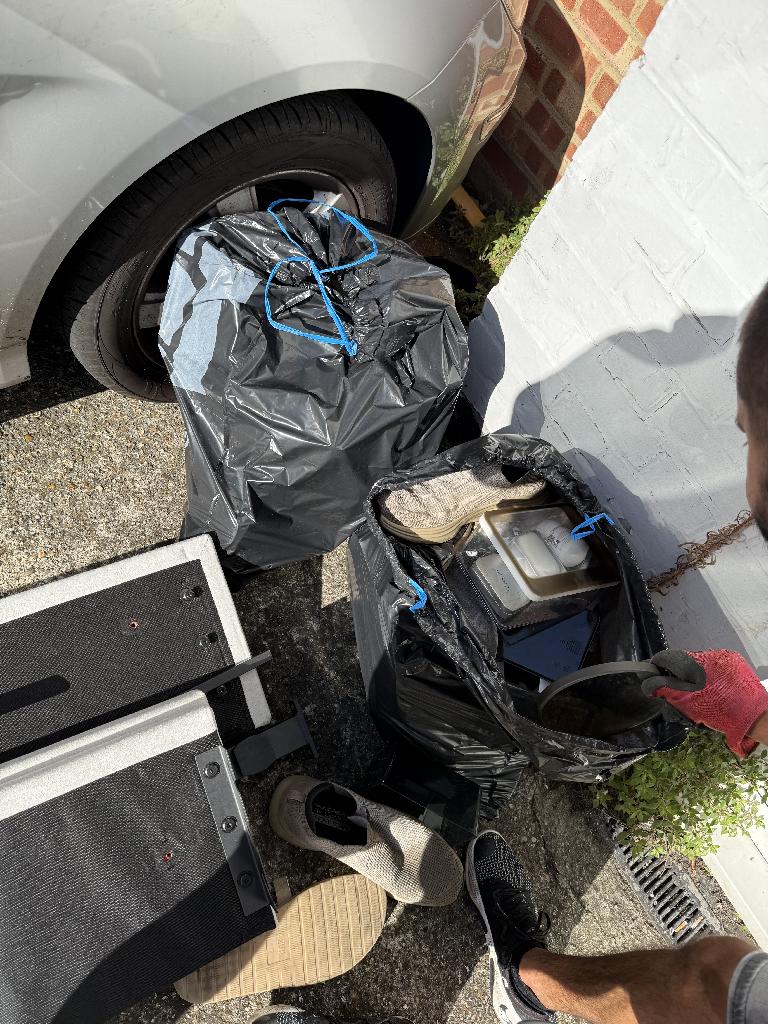 Furniture and household clearance in Twickenham with access to driveway-side clutter and bagged waste ready for removal