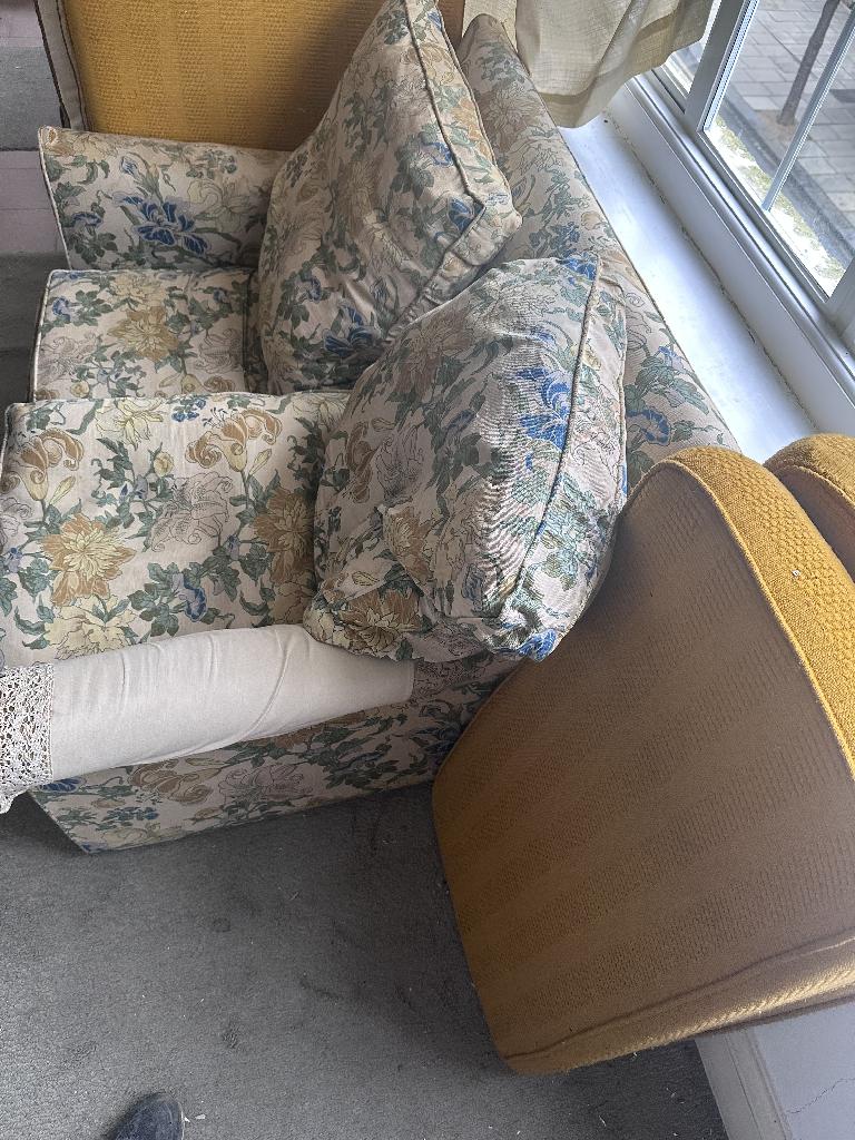 Rubbish removal in Brompton & Hans Town showing sofa cushions and dirty floor before clearance