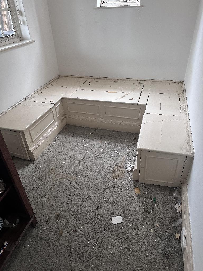 Flat clearance in Chelsea after waste removal, showing a cleared room corner