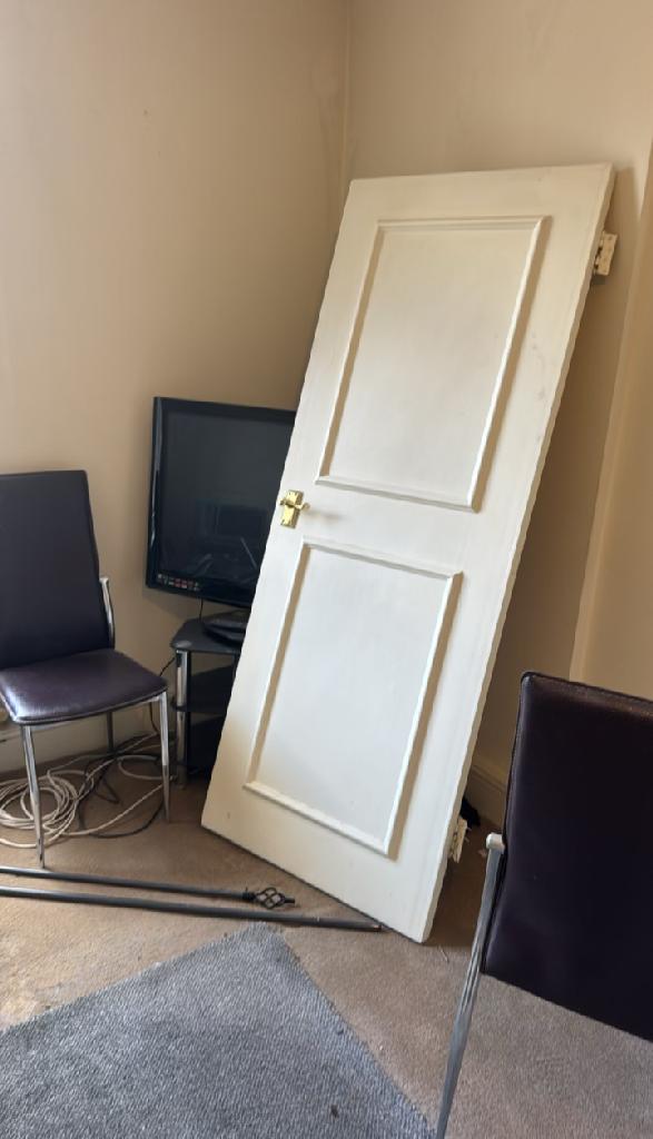 Home renovation waste clearance in Marylebone before clearance shows work items and debris around chairs and a leaning panel