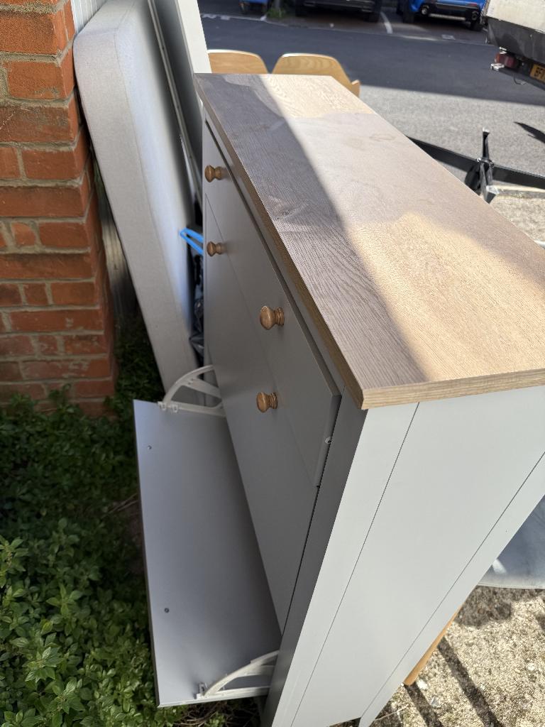 Furniture and household clearance in Twickenham before clearance with a cabinet placed near a wall along a tight corner
