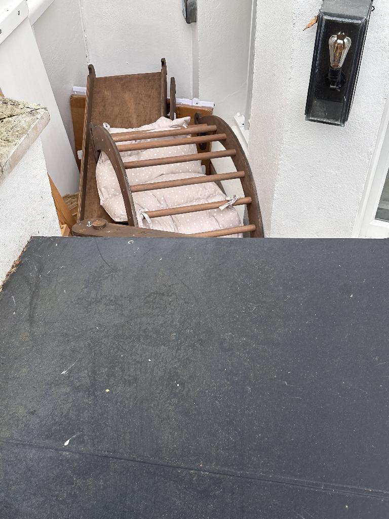 Household furniture clearance in Campden - before, showing cluttered wooden furniture and obstructed walkway area