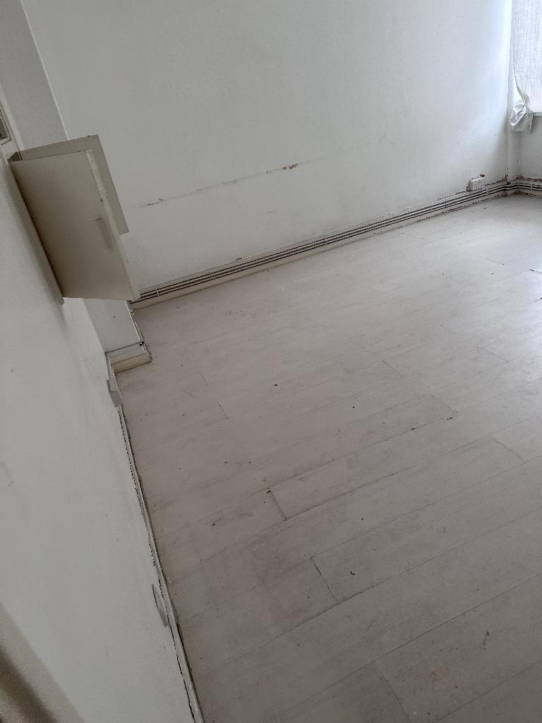 Flat clearance in Rotherhithe after completion, showing a cleared bathroom floor near sanitary fixtures