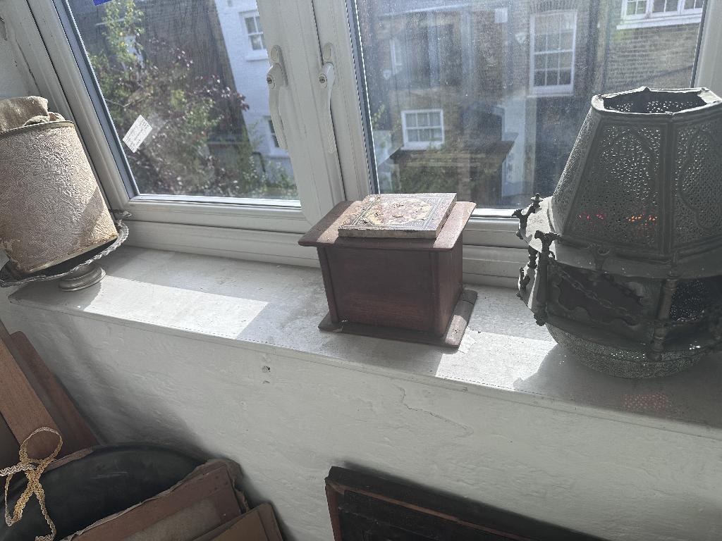 Household clutter clearance in Chelsea before service, showing windowsill clutter
