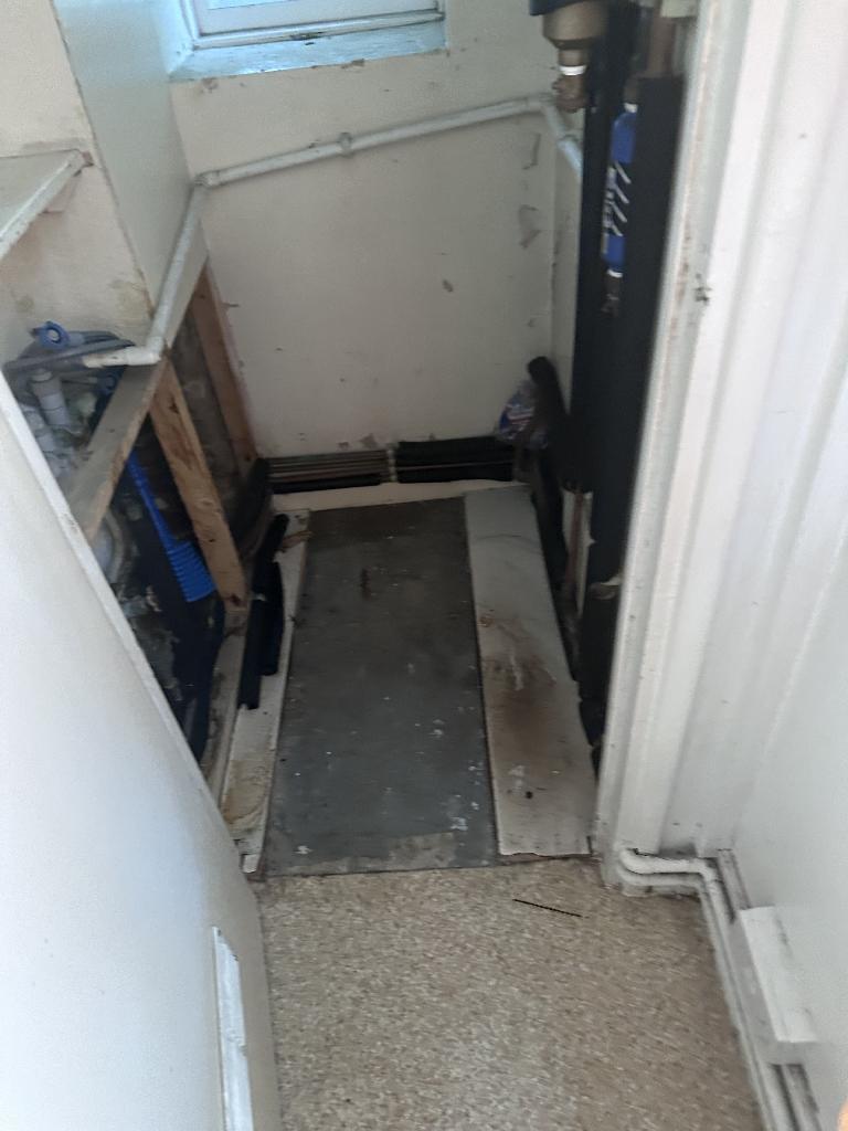 Flat clearance in Rotherhithe after completion, showing a tight corridor cleared for easier access