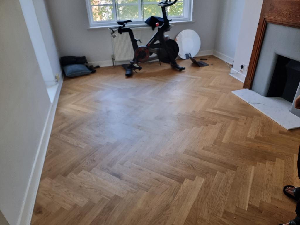 Furniture and bulky item removal in Belsize Park after service, showing a cleaner open floor space