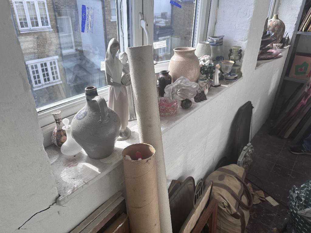 Household clutter clearance in Chelsea before service, showing window-side clutter