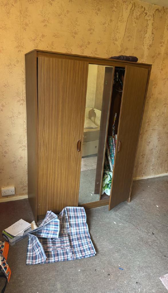 Furniture and household clutter on the floor in Wembley Park before household furniture clearance