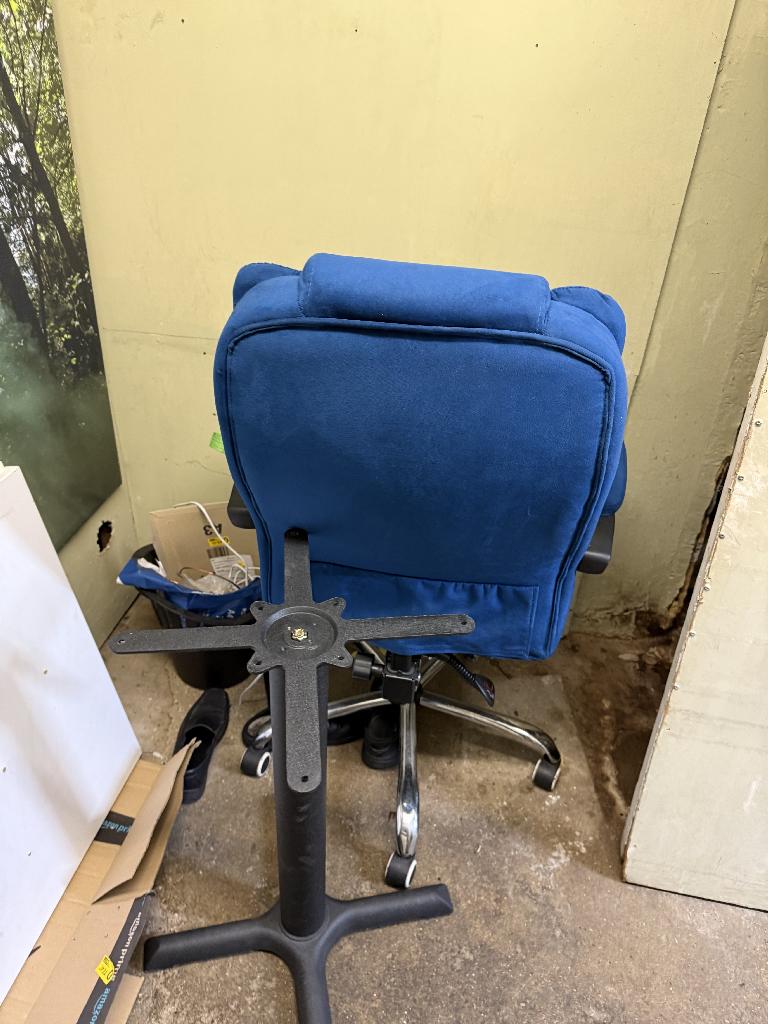 Household utility area clearance in South Richmond after clearance showing a clean corner with an office chair and open floor space