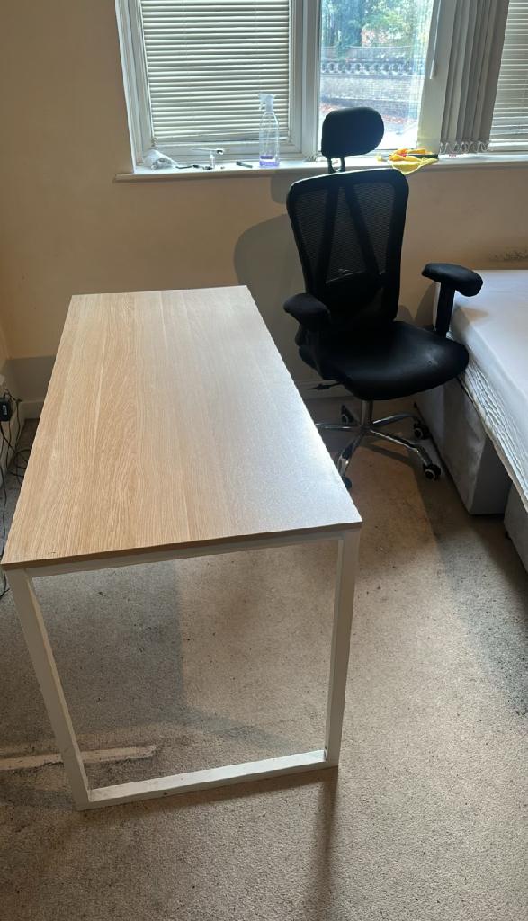 Flat furniture clearance in St Mark's & Seething Wells before the clearance, showing an office chair and desk in a ground-floor flat near the window
