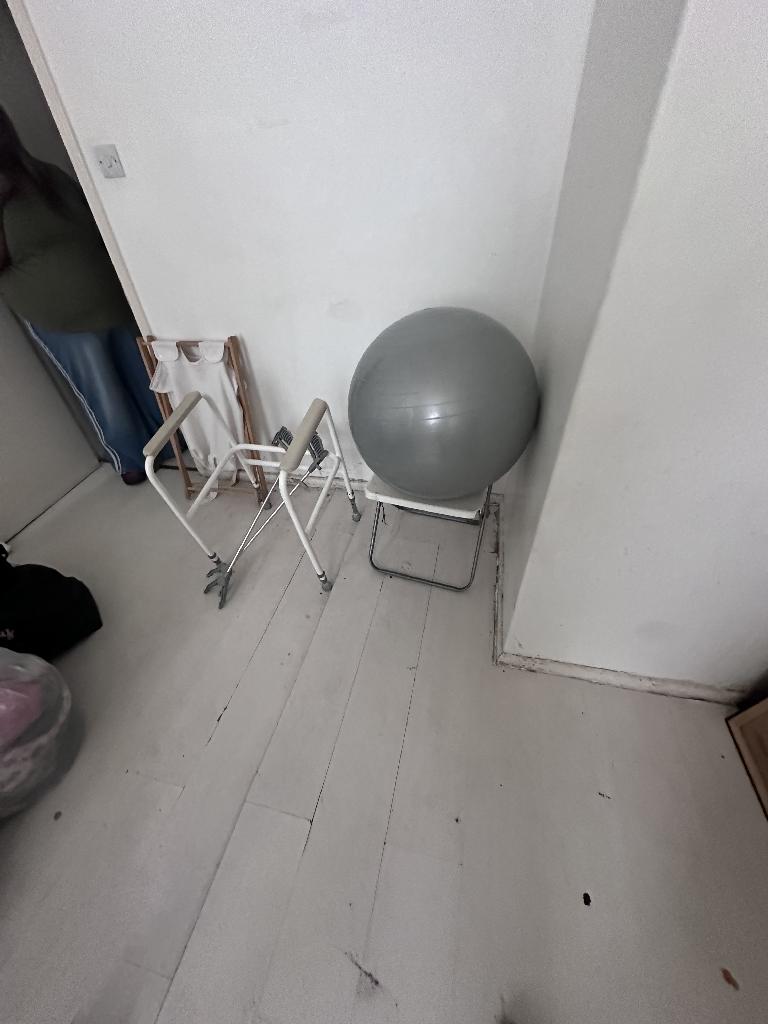 Flat clearance in Rotherhithe before the job, showing bulky panels stored in a cramped recess