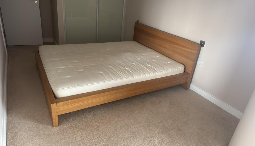 Household furniture clearance in Dalston before clearance, showing a bed occupying the room and restricting usable floor space