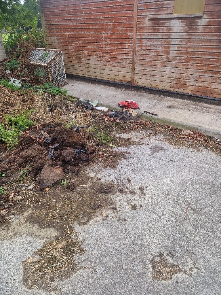 Garden and yard clearance in Putney after the clearance, showing a clearer concrete path along the wall