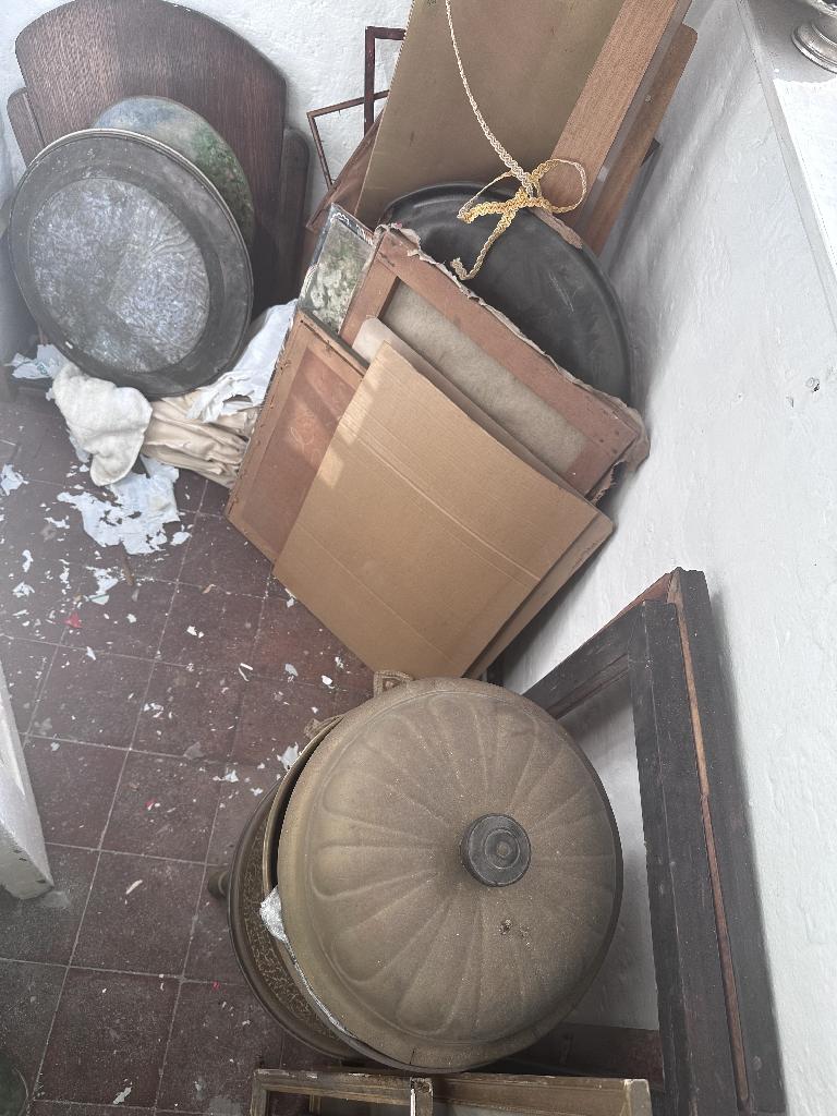 Household clutter clearance in Chelsea before service, showing floor corner waste and bulky items