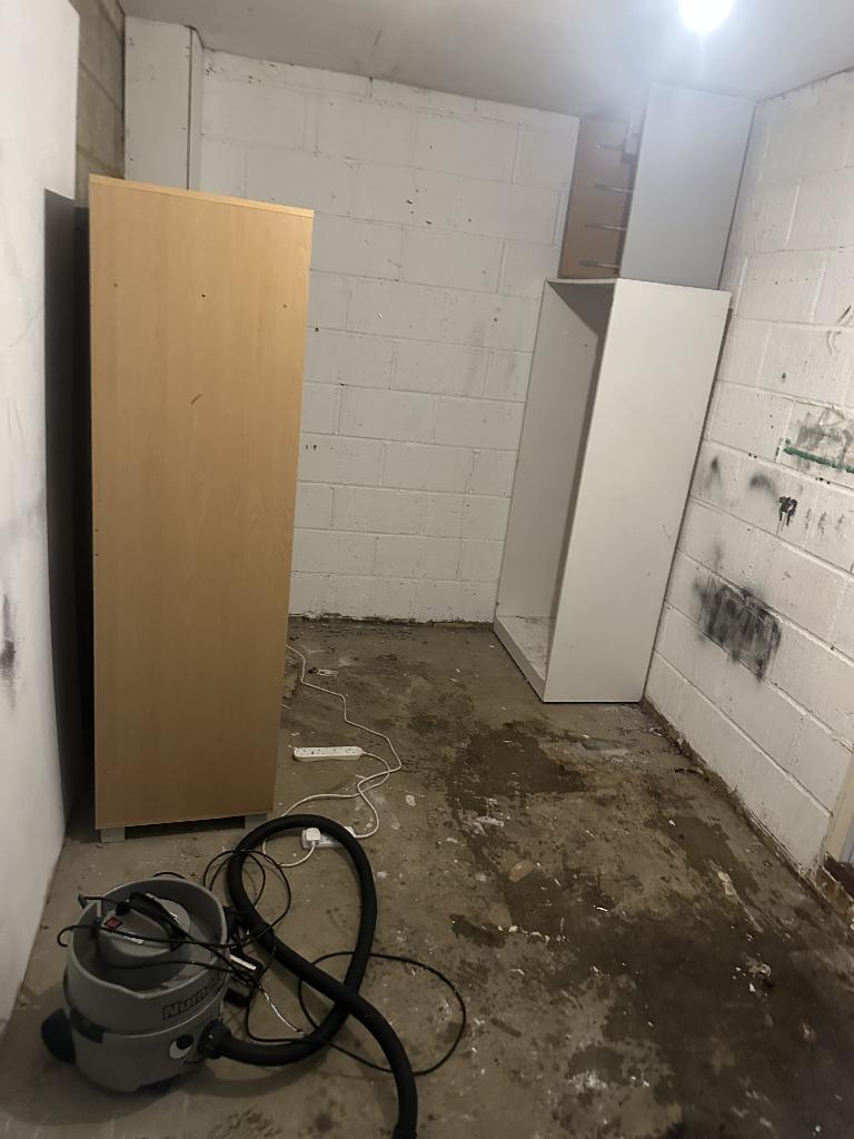 White goods and appliance removal in Balham after service, showing the cluttered utility area cleared of appliances with open floor space