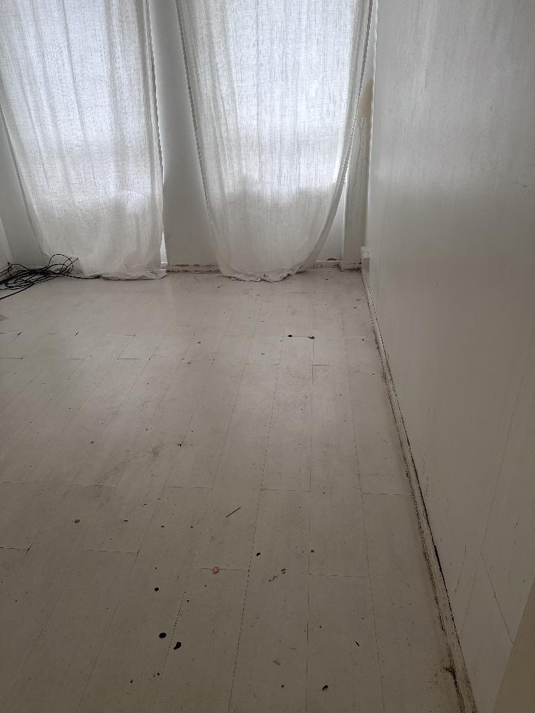 Flat clearance in Rotherhithe after completion, showing an open, clean floor space in the cleared room