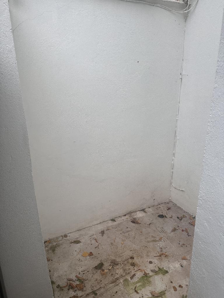 Household furniture clearance in Campden - after, showing cleared corner space near the wall and floor