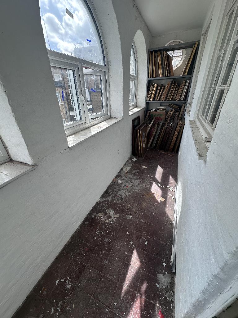 Household clutter clearance in Chelsea after service, showing a cleared windowsill and open floor