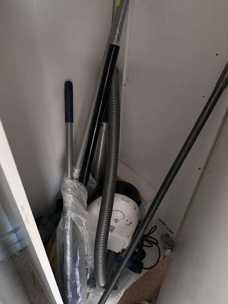Flat clearance in Rotherhithe before the job, showing items clustered in a tight utility space