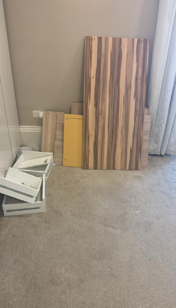 Living room furniture clearance in Hampstead before clearance left the room cluttered with upholstery-adjacent items
