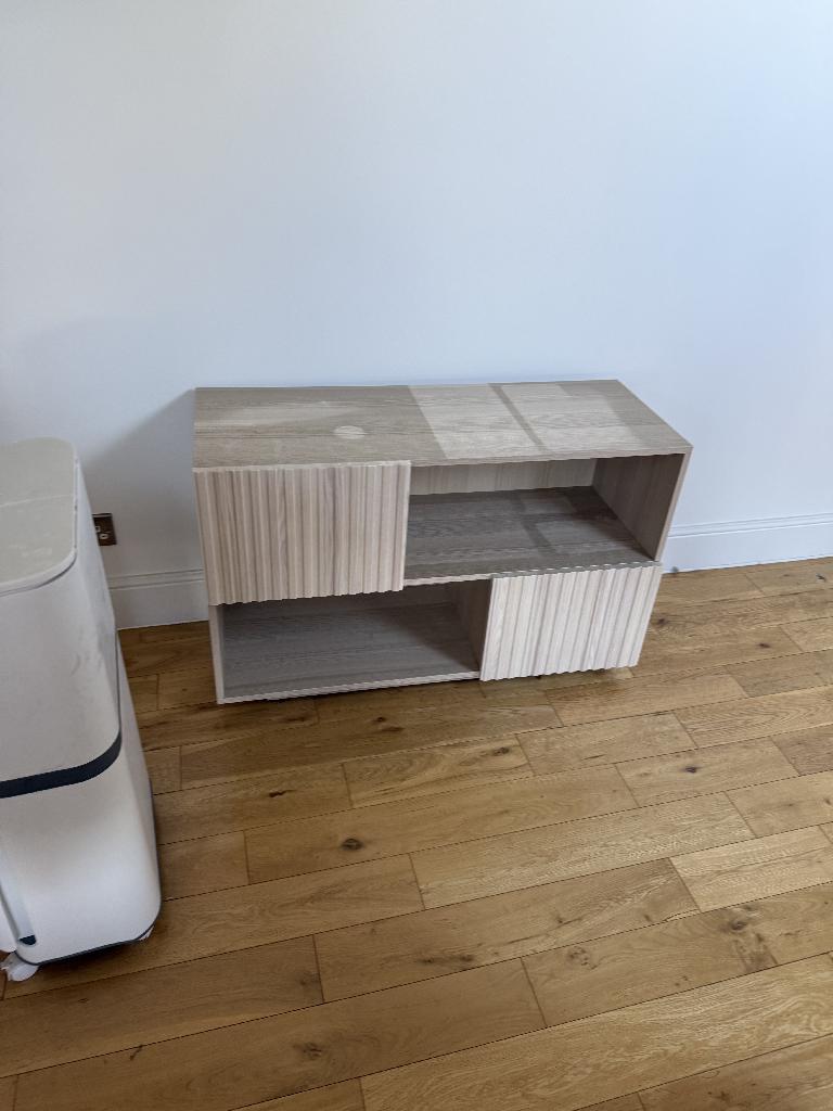 Furniture and bulky item removal in South Richmond after clearance with clean wooden floor and shelving unit in place