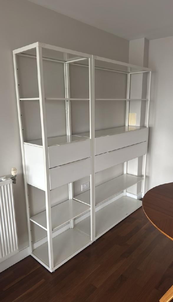 Household furniture clearance in Dalston before clearance, showing a tall shelving unit blocking floor space in the room