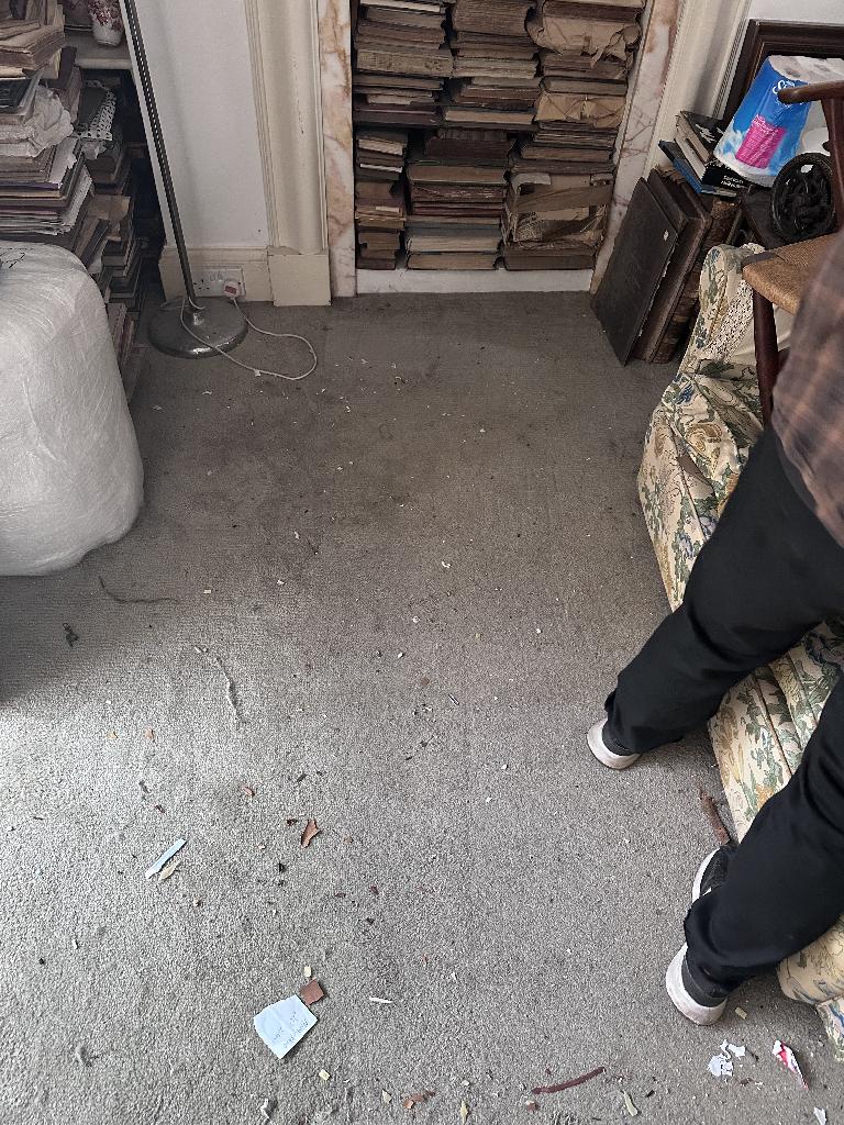 Flat clearance in Chelsea after waste removal, showing a mostly cleared floor