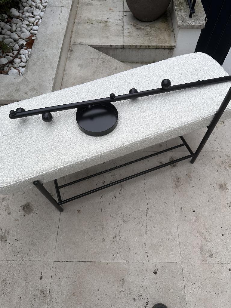 Household furniture clearance in Campden - before, showing a long upholstered bench obstructing outdoor floor space